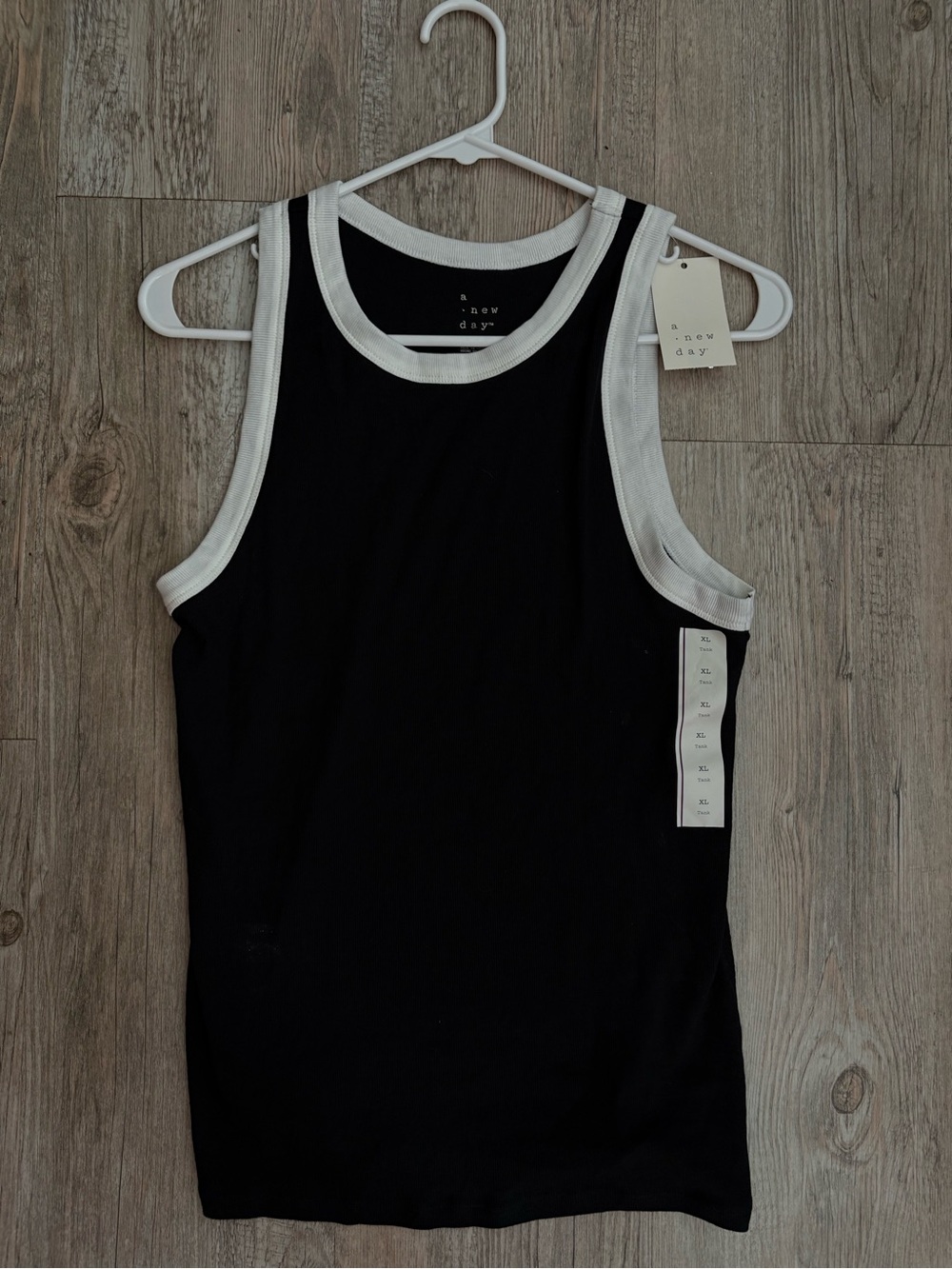 a new day Black Tank with White Trim